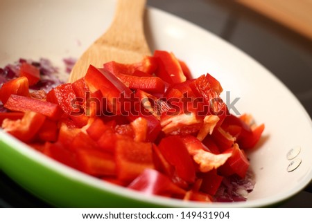 Frying Bell Pepper. Series - making tortilla with chicken and bell pepper.