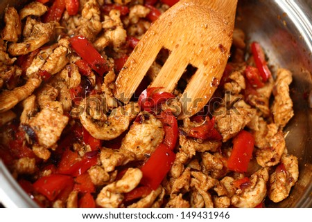 Frying Chicken and Pepper. Series - making tortilla with chicken and bell pepper.