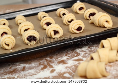 Making Croissant Cookies with Jam. Series. Transfer to baking sheet.