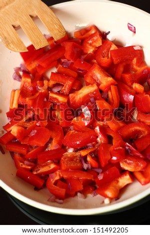 Frying Bell Pepper. Series - making tortilla with chicken and bell pepper.