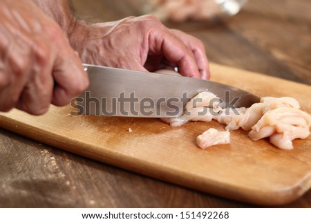 Cutting Chicken Fillet. Series - making tortilla with chicken and bell pepper.