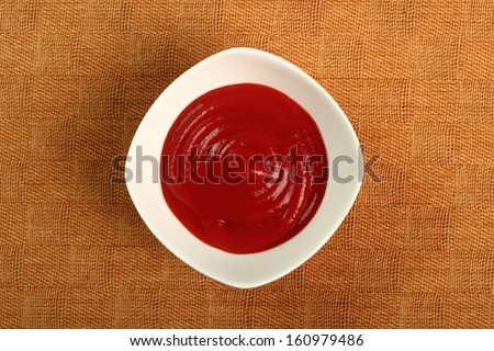 Ketchup in bowl. Directly Above.