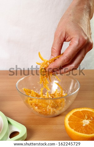 Coating orange peels with sugar. Candied Orange Zest Cooking. Series.