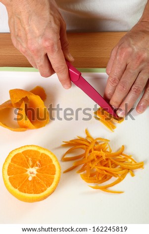 Cut orange peels into strips. Candied Orange Zest Cooking. Series.