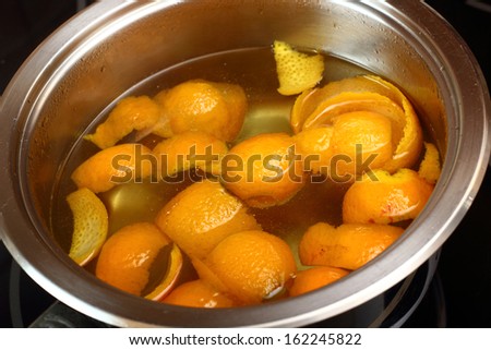 Simmer orange peel into syrup. Candied Orange Zest Cooking. Series.