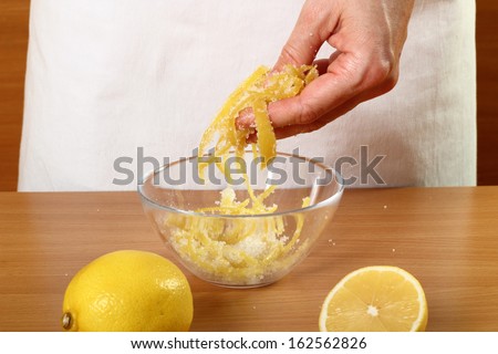 Coating lemon peels with sugar. Candied Lemon Zest Cooking. Series.