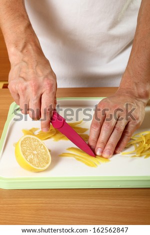 Cut lemon peels into strips. Candied Lemon Zest Cooking. Series.