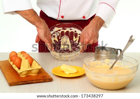 Greasing cake pan with margarine or butter. Making bundt cake with chocolate glaze.