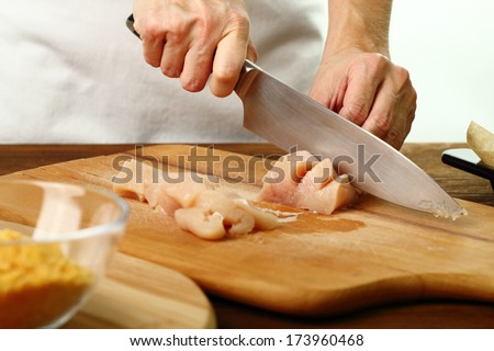 Cutting Chicken Fillet. Making oven baked corn flake crumbs chicken nuggets. Series.
