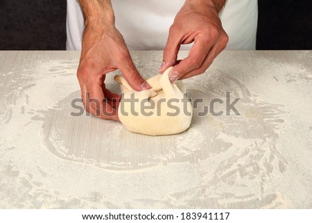 Making Puff Pastry. Bring dough to centre of butter to enclose it completely.
