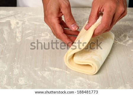 Making Puff Pastry. Folding lower third of dough over centre third and top third  down over that.