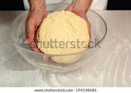 Shape dough into ball and place it in bowl. Dough ready before rising. Making Yeast Sweet Roll Bun