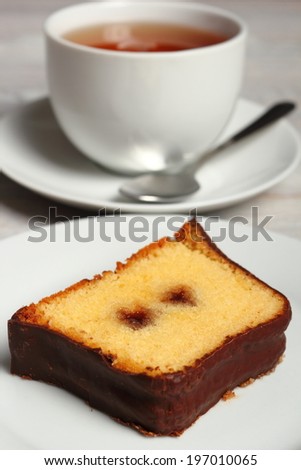 Chocolate glazed loaf cake with strawberry jam