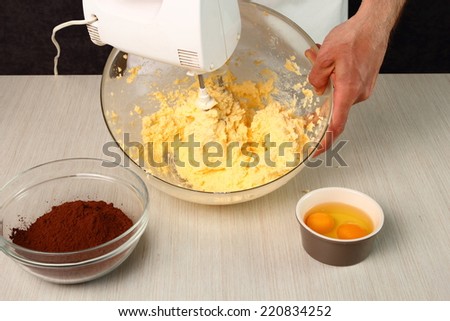 Combine butter and sugar with mixer. Making Chocolate Cookies.