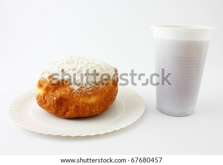 Breakfast. Donut on a Disposable Plate with Tea.