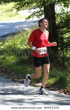 KRYNICA-ZDROJ, POLAND - SEPT 11: The runner Niedziela Slawomir is running a marathon (control point 39km) at Economic Forum Polish Running Festival September 11, 2011 in Krynica-Zdroj, Poland