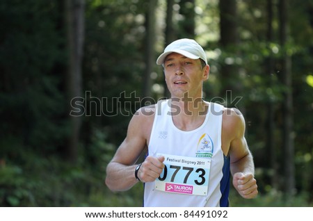 KRYNICA-ZDROJ, POLAND - SEPT 11: The runner Piwonski Arkadiusz is running a marathon (control point 39km) at Economic Forum Polish Running Festival September 11, 2011 in Krynica-Zdroj, Poland