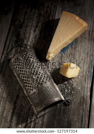 Antique Cheese Grater With Parmesan Cheese.