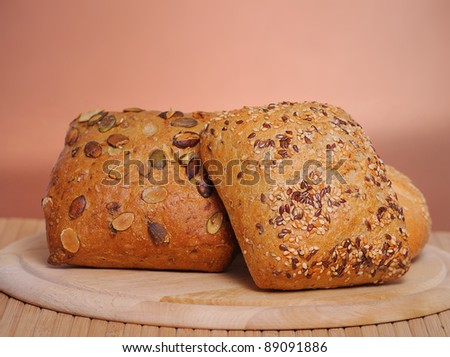 Bread and rolls on a cherry wood table