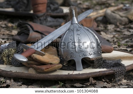 The helmet and sword on a shield