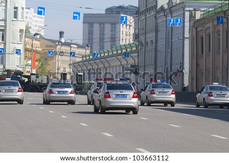 MOSCOW, RUSSIA - MAY 6: Police cars complete the passage of military vehicles through the streets of Moscow after the rehearsal of the Victory Day Parade on May 6, 2012 in Moscow, Russia.