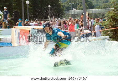 RUSSIA, MOSCOW-JULY 13: An unidentified rider performs intricate tricks for wakeboarding in the sports festival Moscow City Games 2013 in Moscow, Arena Luzhniki; on July 13, 2013
