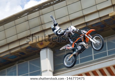 RUSSIA, MOSCOW-JULY 13: motofristayler Kirill Kuznetsov at the sports festival Moscow City Games 2013 in the program Moto Freestyle (FMX) in Moscow, Arena Luzhniki; on July 13, 2013
