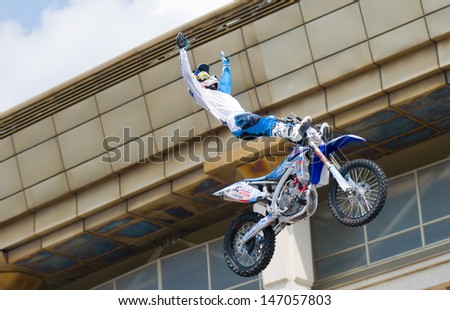 RUSSIA, MOSCOW-JULY 13: Leading motofristayler Russia Alexey Kolesnikov at the sports festival Moscow City Games 2013 in the program Moto Freestyle (FMX) in Moscow, Arena Luzhniki; on July 13, 2013