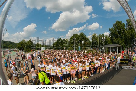 RUSSIA, MOSCOW-JULY 13: Several unidentified runners starting at start line of mass race Adidas energy run at the sports festival \