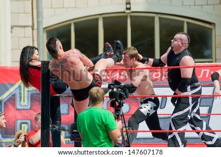 RUSSIA, MOSCOW-JULY 13: An unidentified wrestlers Professional wrestling are fighting in the ring in the sports festival \