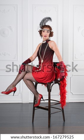 Retro Woman Portrait. Beautiful Woman on a bar stool