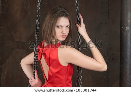 Young beautiful fashion woman in metallic chain