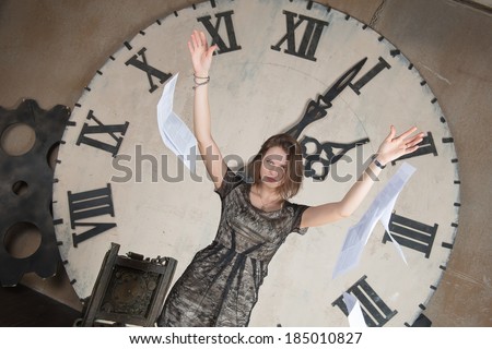 Girl throws paper on background of the clock