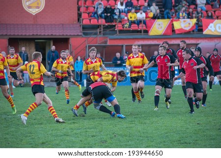 MOSCOW - MAY 13: Some players in action at rugby Russian Rugby Championship 2014 match between Slava CSP (yellow) and Metallurg (black), score 20-13, on May 13, 2014, in Moscow stadium Slava Russia.