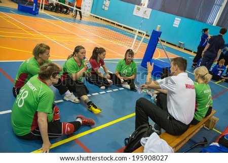 MOSCOW - MAY 11: Players team Hungary (green) and coach at 4 Open Moscow sitting volleyball match between Hungary (green) and Finland (blue), on May 11, 2014, in Moscow stadium CSP Izmailovo, Russia