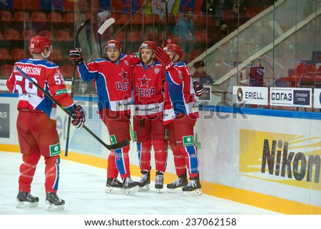 MOSCOW - DECEMBER 3: Hockey players CSKA rejoice scored a goal on game CSKA vs Severstal on Russian KHL premier hockey league Championship on December 3, 2014, in Moscow, Russia. CSKA won 9: 1