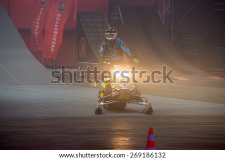 RUSSIA, MOSCOW-MARCH 14: Heath Frisby (USA) doing tricks on his snowmobile at the VIII festival of extreme sports in the Olympic Sports Complex Moscow, Russia, on March 14, 2015