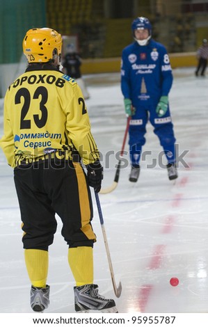 MOSCOW - FEBRUARY 22: Free-stroke in Bandy match Dynamo (blue) - Moorman (yellow) in ice sports palace Krylatskoye on February 22, 2012 in Moscow, Russia. Dynamo won 11 - 3