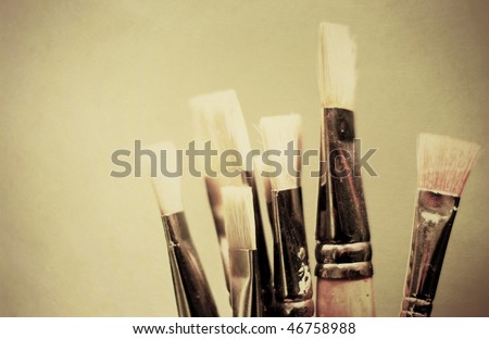 Paint brushes with texture applied and cross processed.
