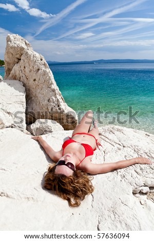 Woman lying on the rock