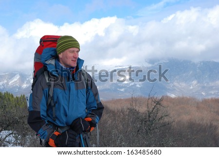 Crimean hiking. Winter day. Hiker at the top