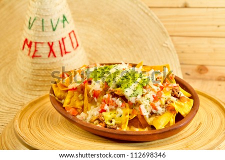 Plate of fresh nachos with a jalapeno cheese sauce