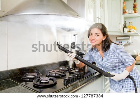 Smiling young woman with rubber gloves cleaning air duct purifier