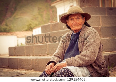 ANDAHUAYLILLAS PERU -JANUARY 15: Quechua woman begs for money at the main church in Andahuaylillas, Peru on January 15, 2013. Andahuaylillas is a popular destination for tourism from Peru.