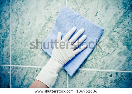 Female Hand Cleaning Kitchen Tiles With Sponge Color Processed