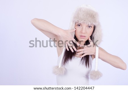 Winter Fashion. Fur Hat. Beautiful Girl in Furry Hat. Winter Woman Portrait