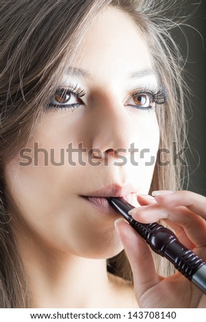 woman smokes arab pipe