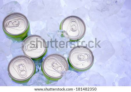 green Cans of Beer in Ice Cubes