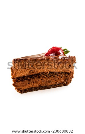 chocolate mousse cake with one strawberry on top