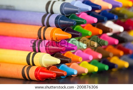 pyramid of multicolored new crayons bright closeup